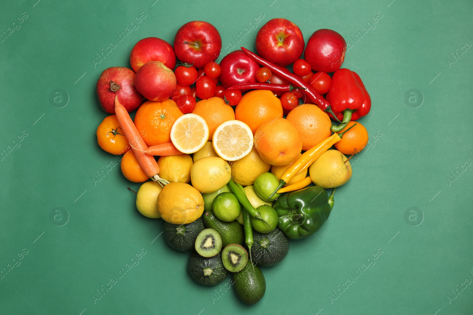 Photo of Rainbow composition with ripe fruits and vegetables on color background, top view