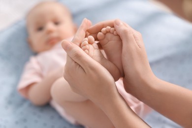 Photo of Mother with her cute little baby in crib, selective focus