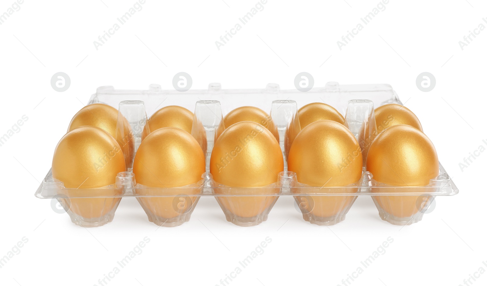 Photo of Many shiny golden eggs in plastic container on white background