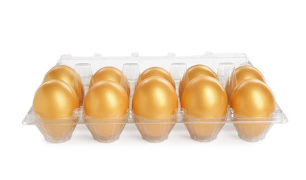 Many shiny golden eggs in plastic container on white background