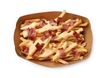 Photo of Tasty potato fries, cheese sauce and bacon in paper container isolated on white, top view