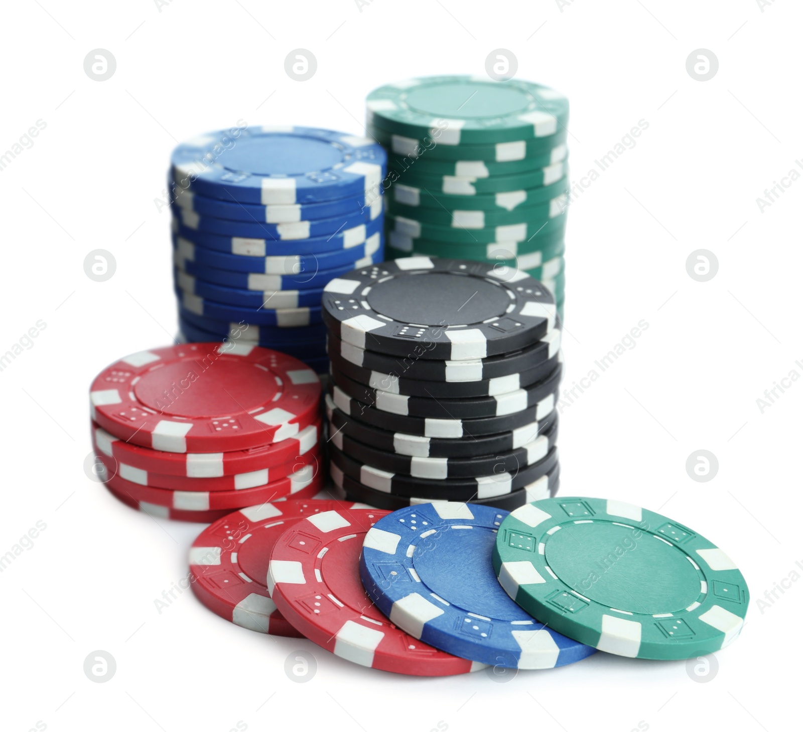 Photo of Plastic casino chips stacked on white background. Poker game