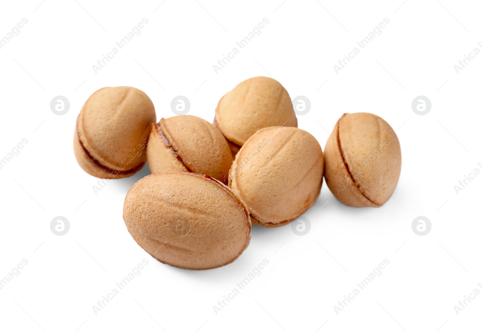 Photo of Delicious nut shaped cookie with boiled condensed milk on white background