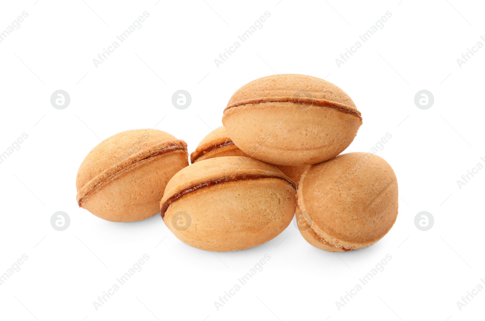 Photo of Delicious nut shaped cookies with boiled condensed milk on white background