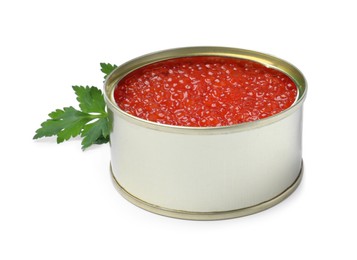 Photo of Open tin can of delicious red caviar and parsley on white background