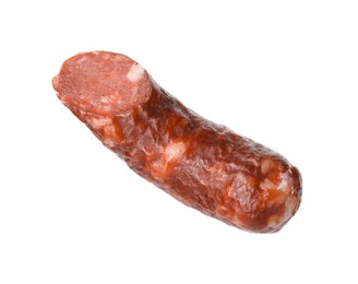 Piece of thin dry smoked sausage isolated on white