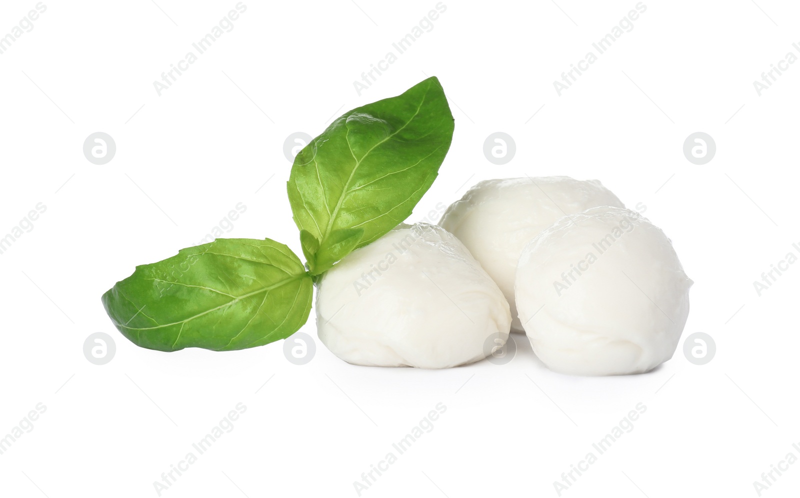 Photo of Delicious mozzarella cheese balls and basil on white background