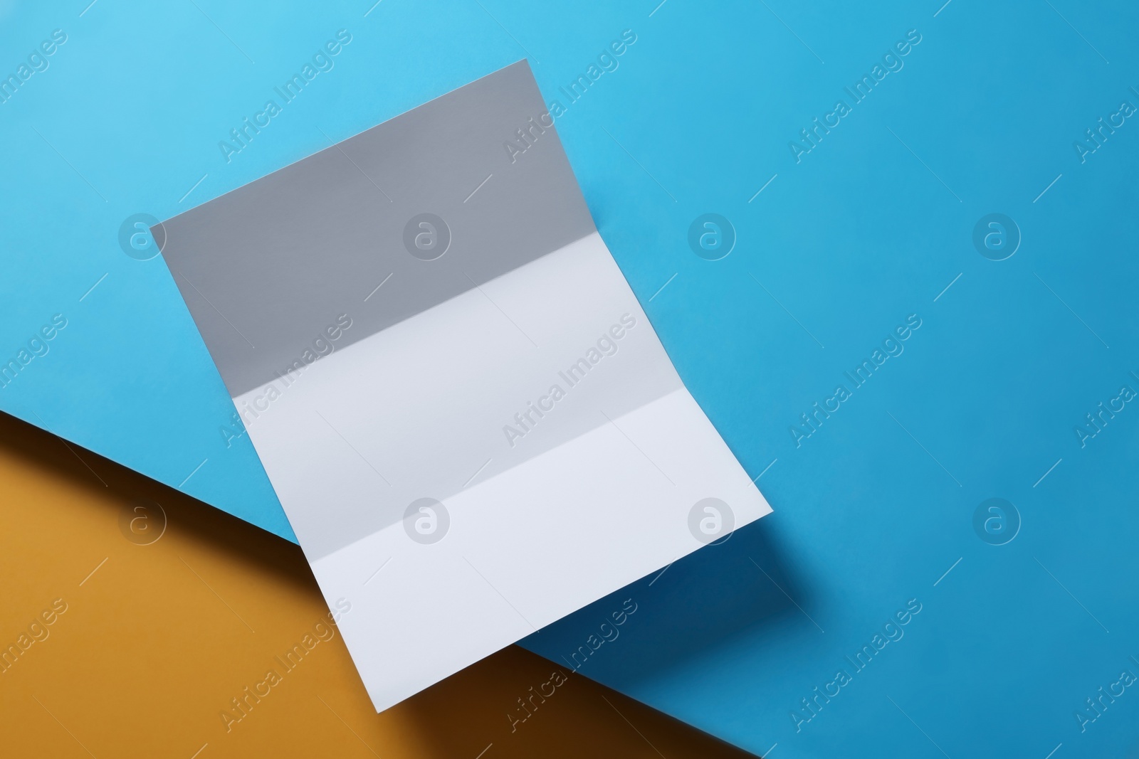 Photo of Empty flyer on color background. Mockup for design