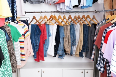 Modern dressing room with different stylish clothes