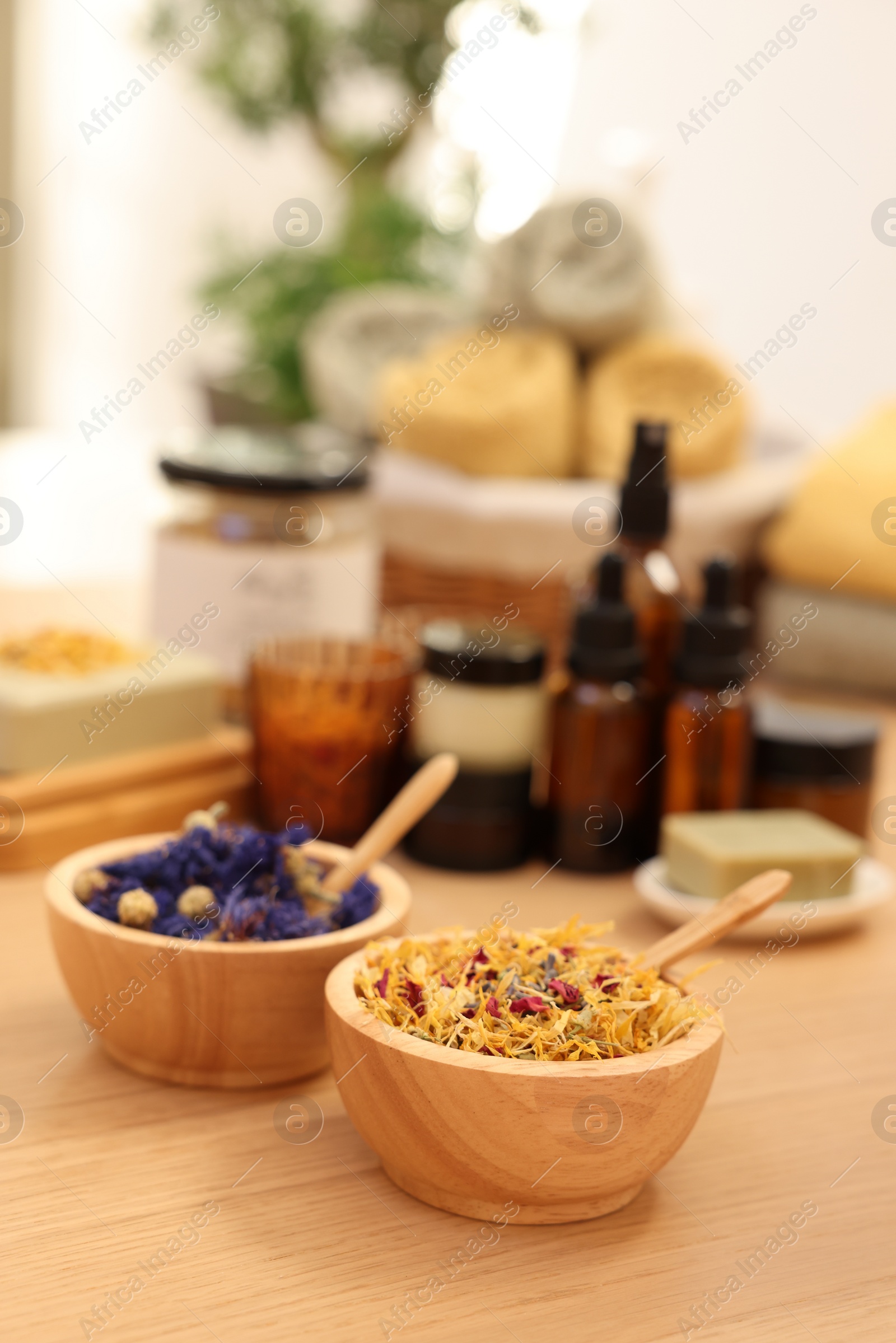 Photo of Dry flowers on wooden table indoors, space for text. Spa time