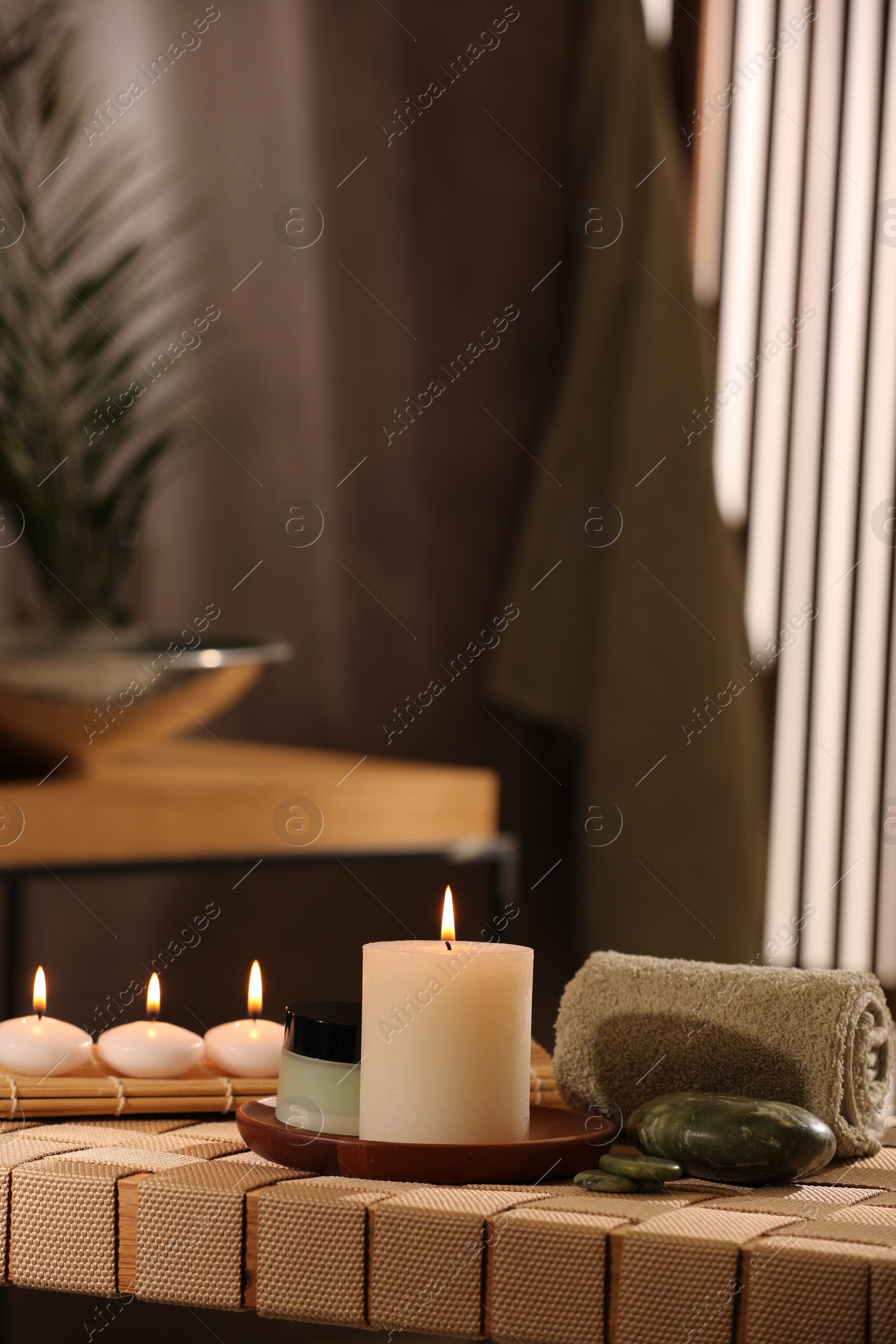 Photo of Beautiful composition with different spa products on wicker bench indoors