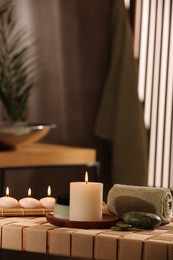 Beautiful composition with different spa products on wicker bench indoors