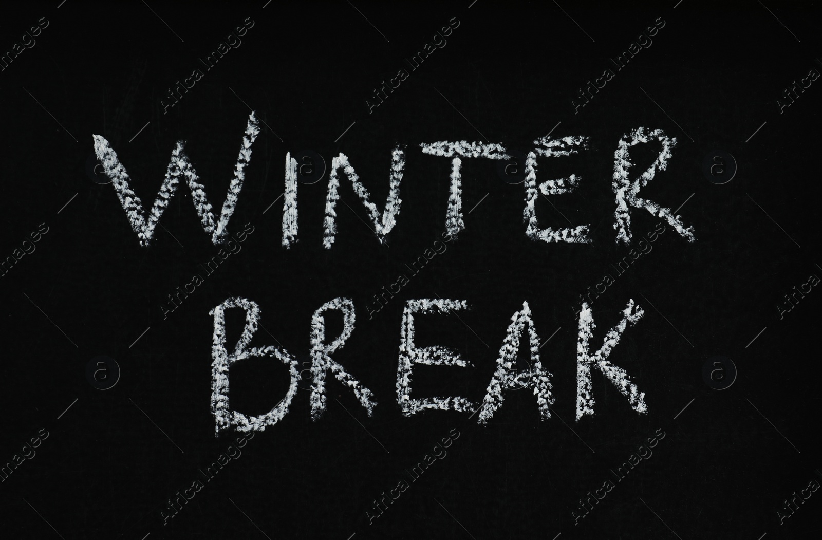 Photo of Phrase Winter Break written on black chalkboard. Holidays concept