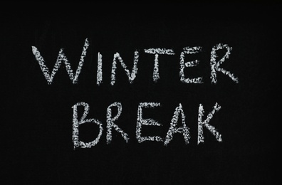 Photo of Phrase Winter Break written on black chalkboard. Holidays concept