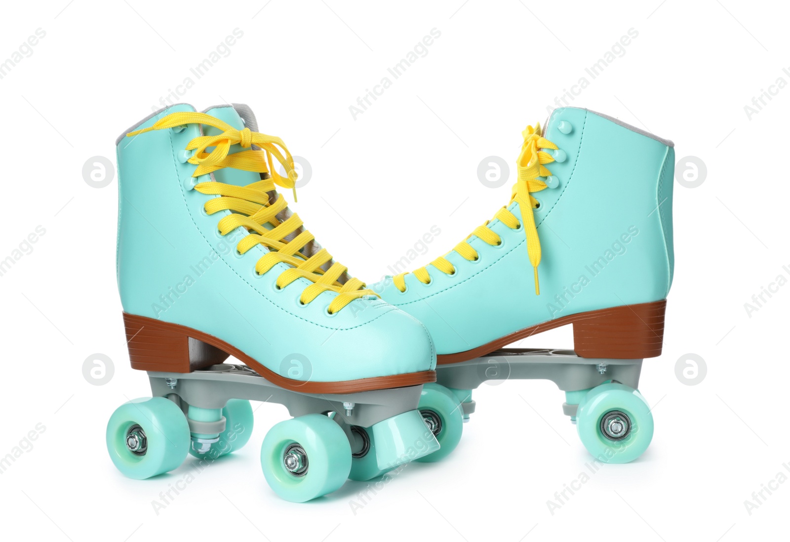 Photo of Pair of bright stylish roller skates on white background