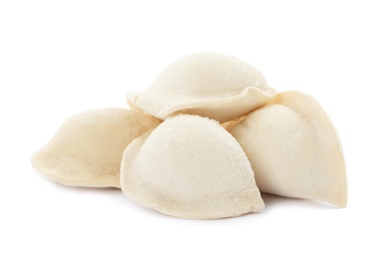 Photo of Heap of raw dumplings on white background