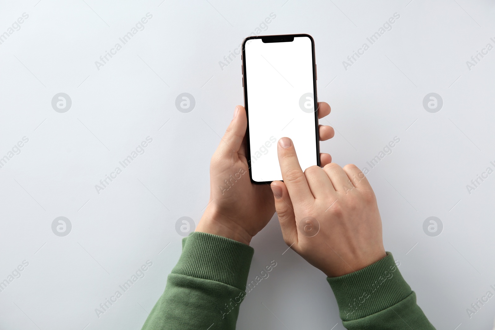 Photo of Man using smartphone on white background, top view