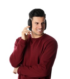 Man wearing stylish earmuffs on white background