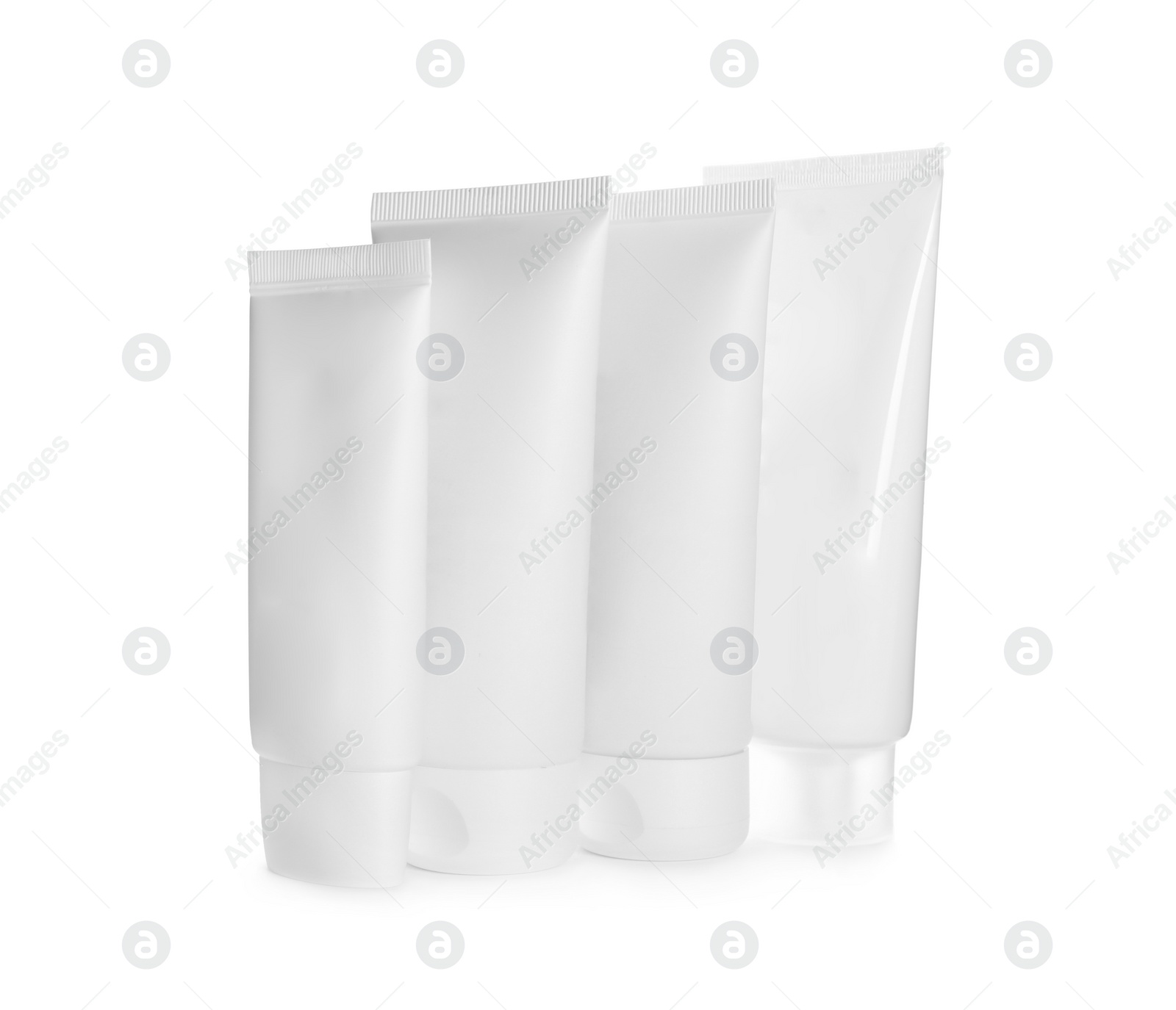 Photo of Blank tubes of cosmetic products on white background