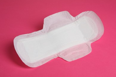 Photo of Sanitary napkin on pink background. Gynecology concept