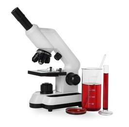 Laboratory glassware with red liquid and microscope isolated on white