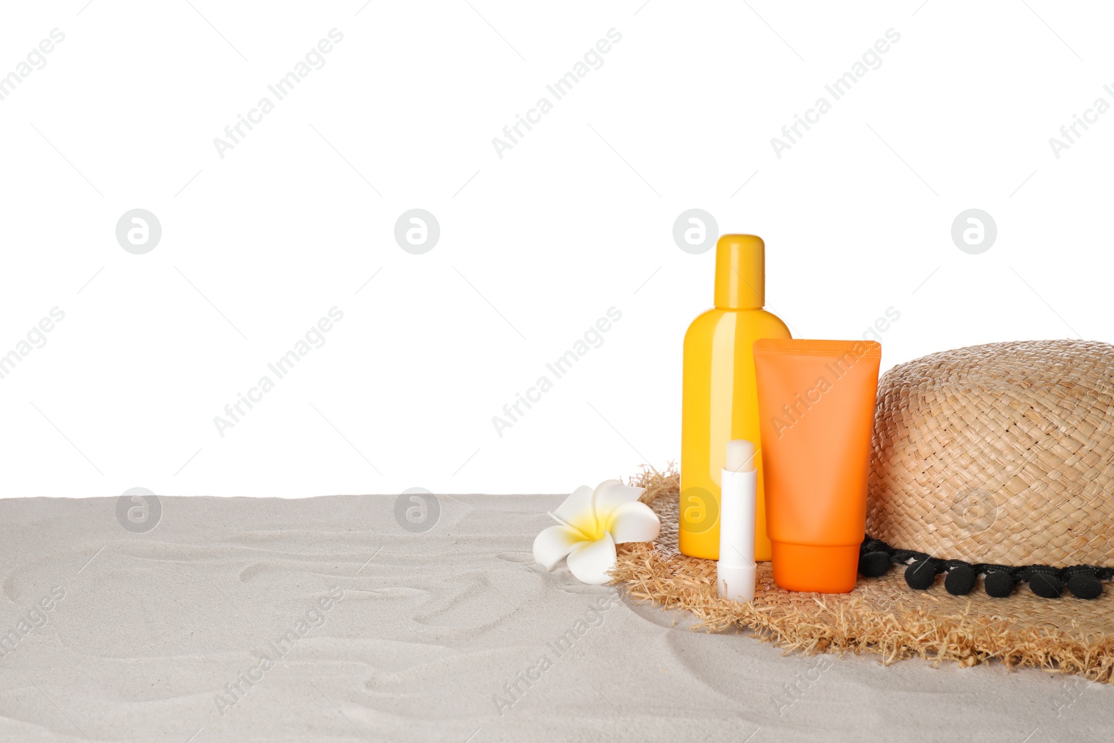 Photo of Composition with sun protection products on sand against white background. Space for text