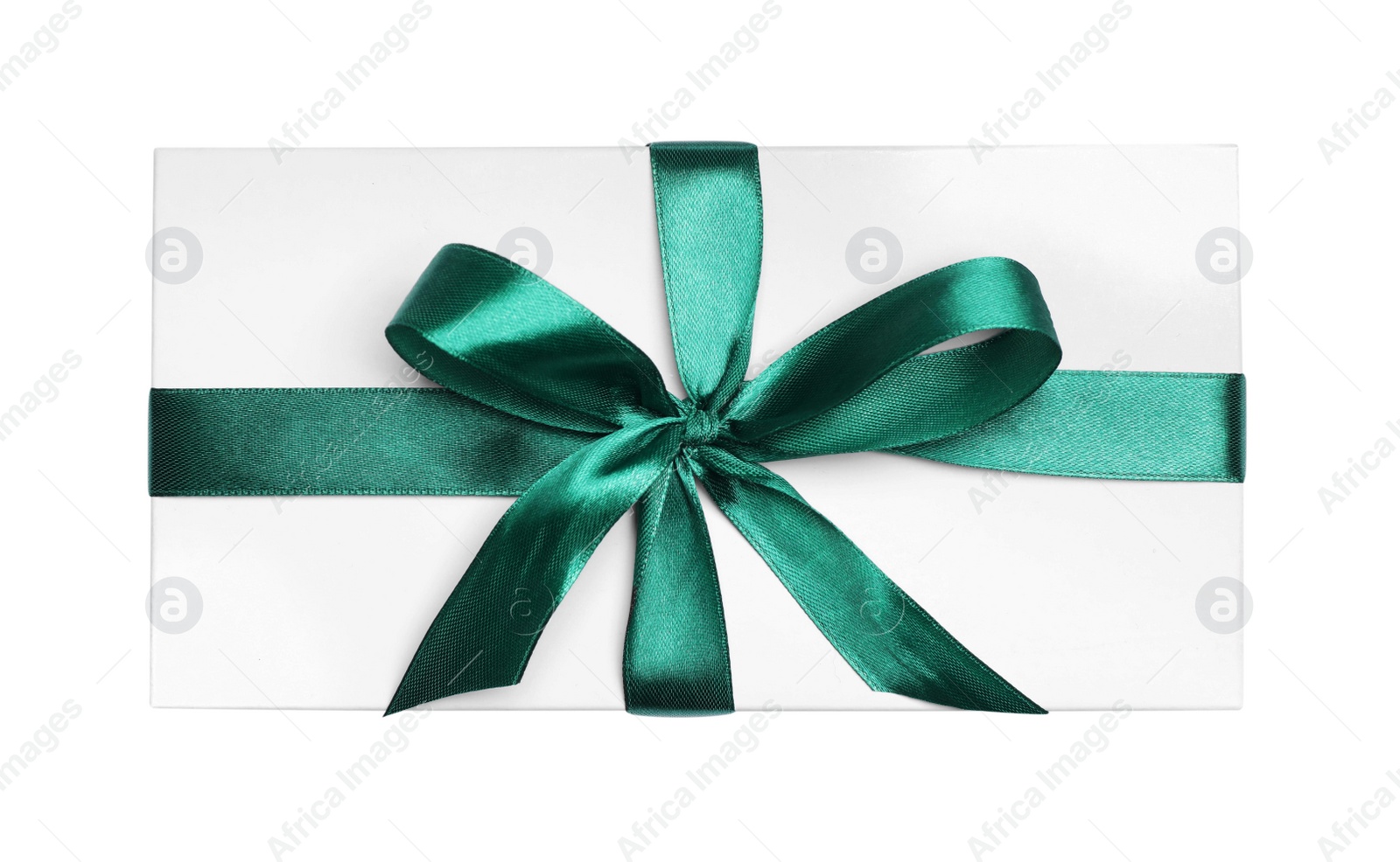 Photo of Christmas gift in box with green ribbon isolated on white, top view