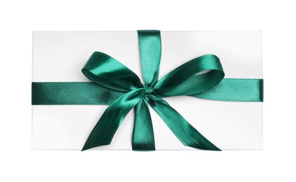 Photo of Christmas gift in box with green ribbon isolated on white, top view