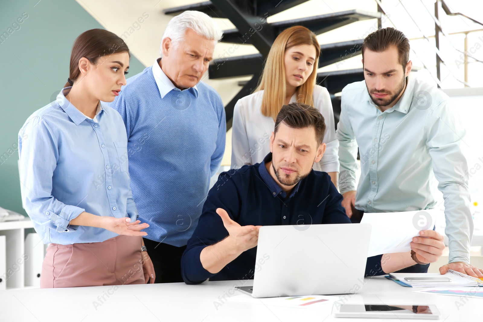 Photo of Office employees having argument during business meeting