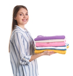 Photo of Happy young woman holding clean towels on white background. Laundry day