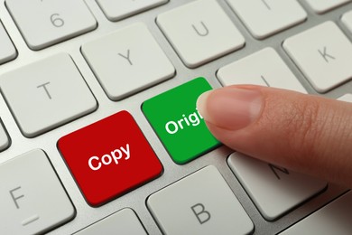 Image of Woman pressing green button with word Original on computer keyboard, closeup. Plagiarism concept