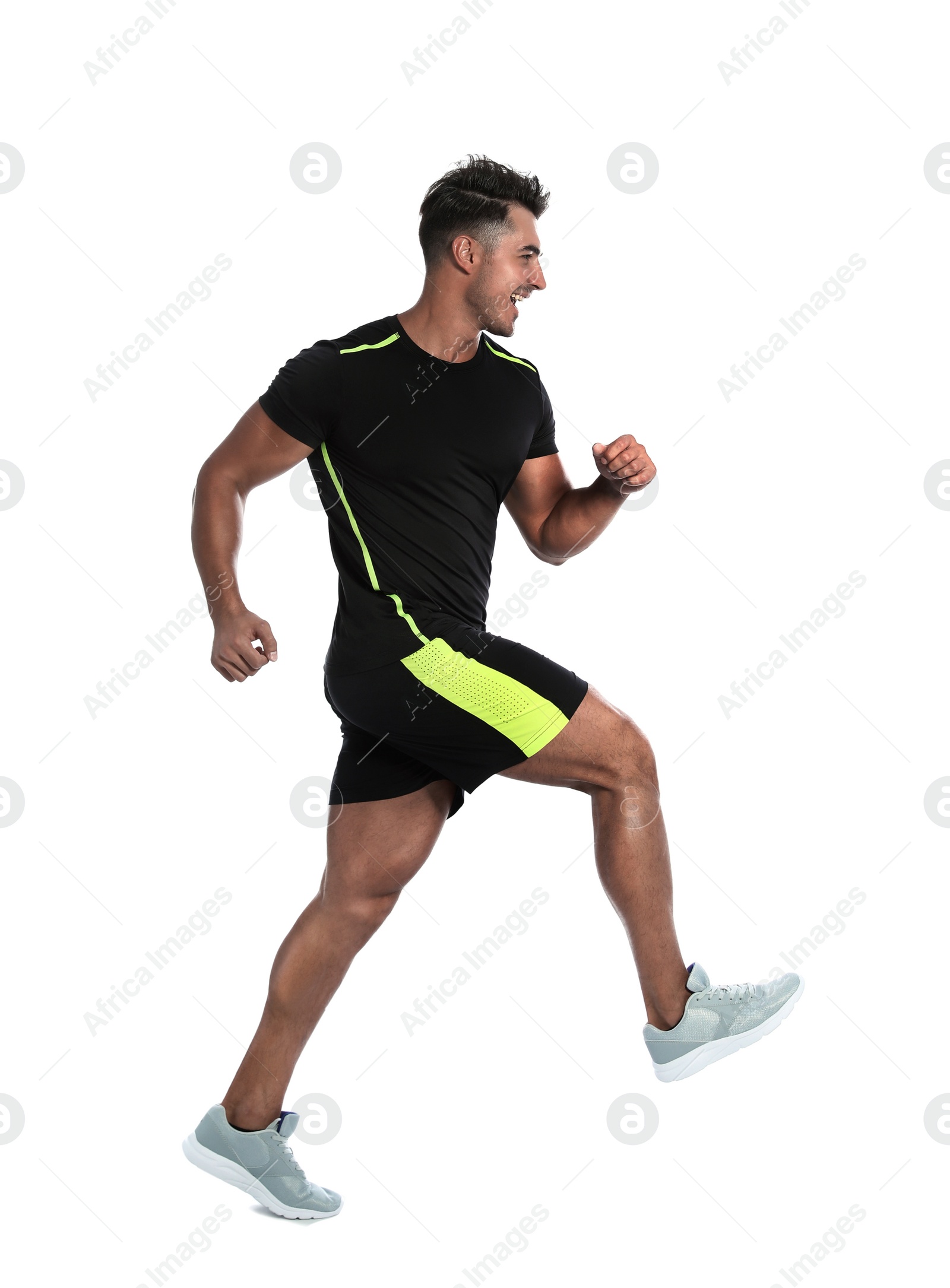 Photo of Sporty young man running on white background