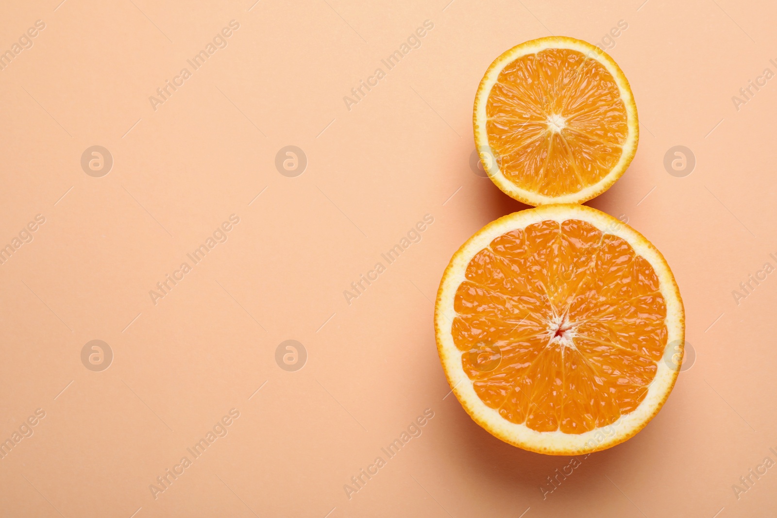 Photo of 8 March greeting card design with cut citrus and space for text on orange background, flat lay. International Women's day