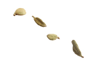 Photo of Dry cardamon seeds on white background. Mulled wine ingredient