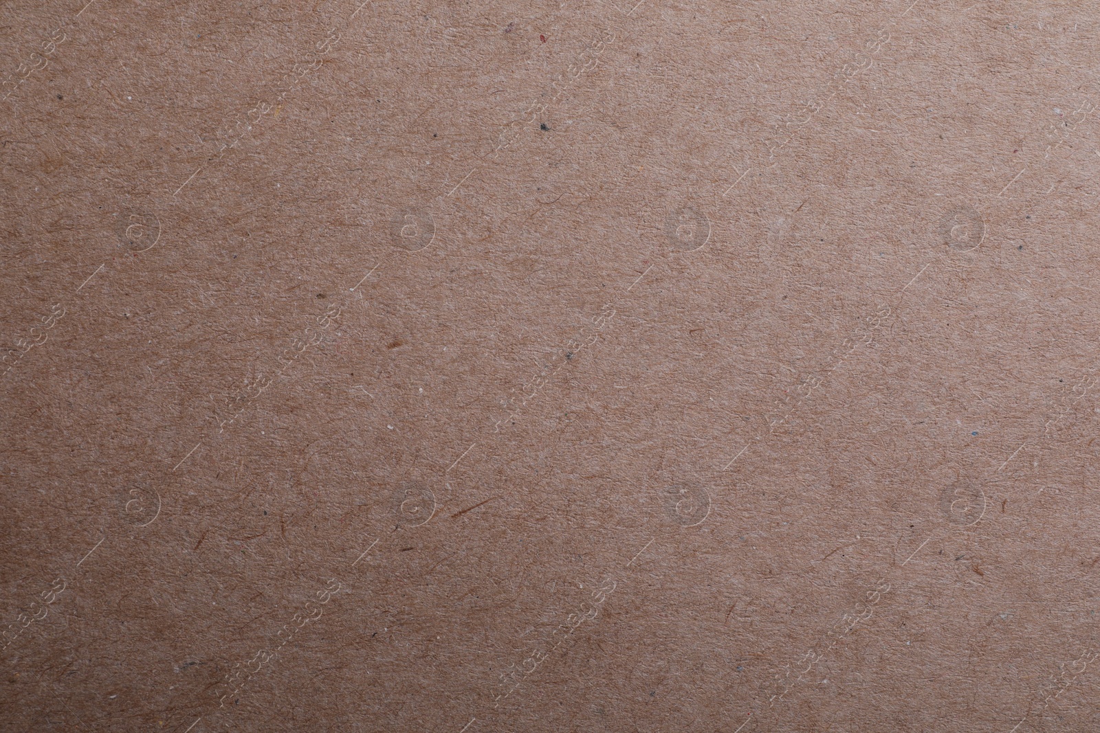 Photo of Texture of kraft paper bag as background, closeup