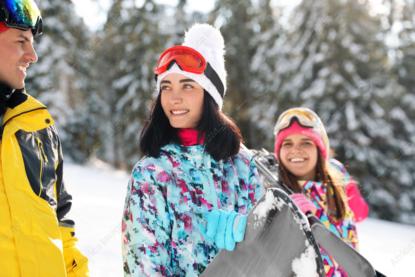 Photo of Group of friends with equipment in snowy mountains. Winter vacation