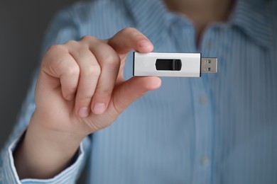 Photo of Woman holding usb flash drive, closeup view