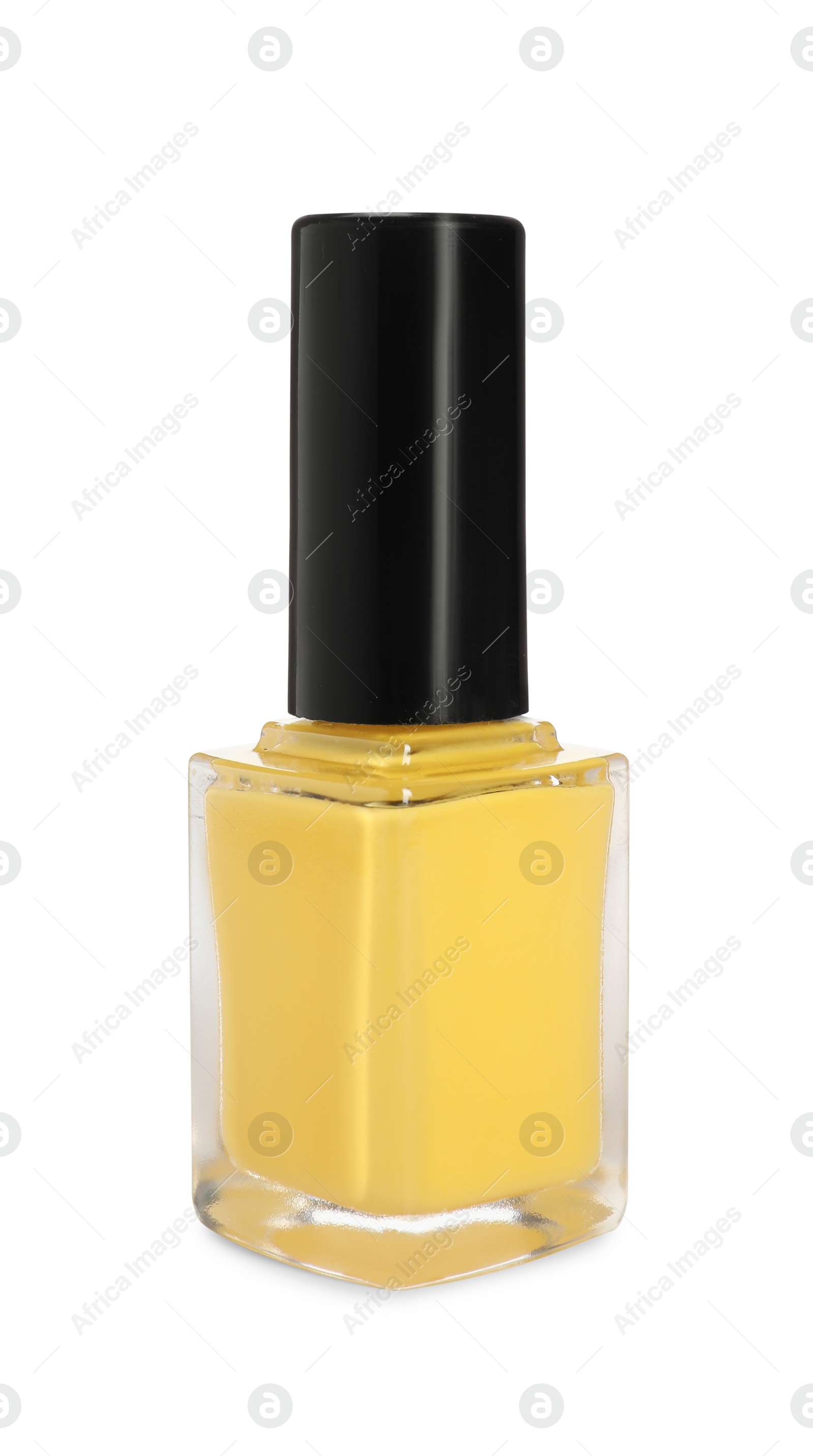 Photo of Yellow nail polish in bottle isolated on white