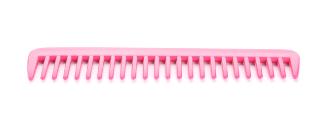 Photo of New pink hair comb isolated on white