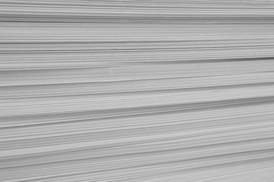 Photo of Stack of white paper sheets, closeup view