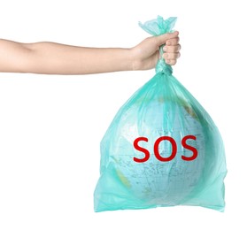 Woman holding globe with word SOS in plastic bag on white background, closeup. Environmental protection concept