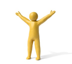 Photo of Human figure with arms wide open made of yellow plasticine isolated on white