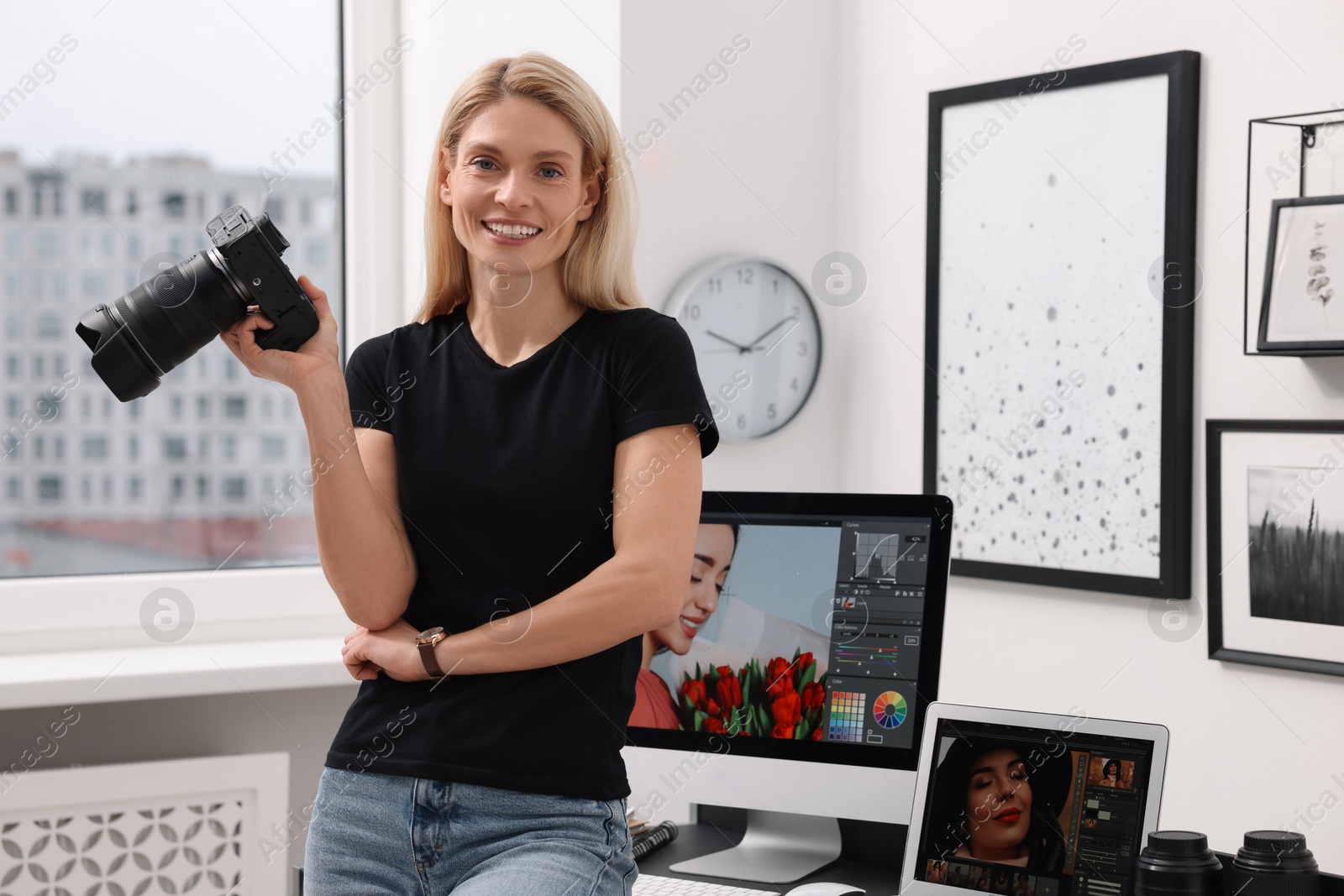 Photo of Professional photographer with modern digital camera in office