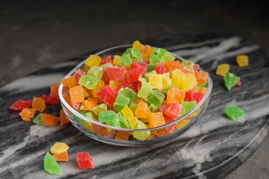 Mix of delicious candied fruits on marble board, closeup