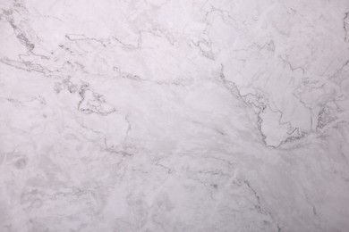 Photo of Texture of white marble surface as background, closeup