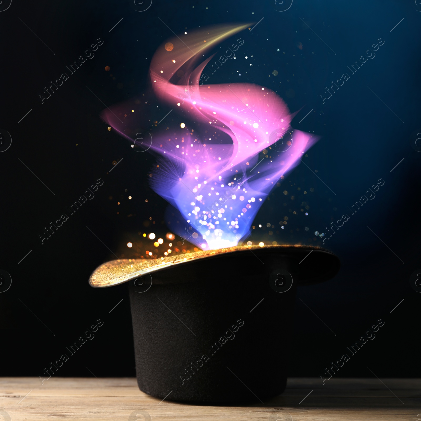 Image of Wizard's hat with magical light on dark background