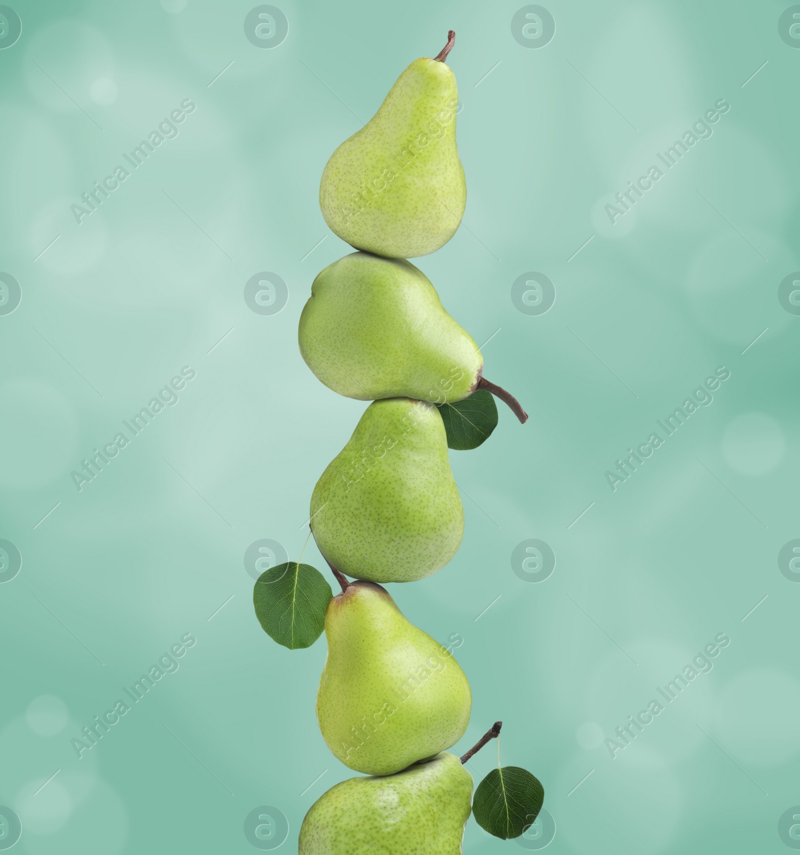 Image of Whole fresh ripe pears on aquamarine background