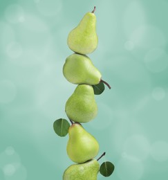 Image of Whole fresh ripe pears on aquamarine background