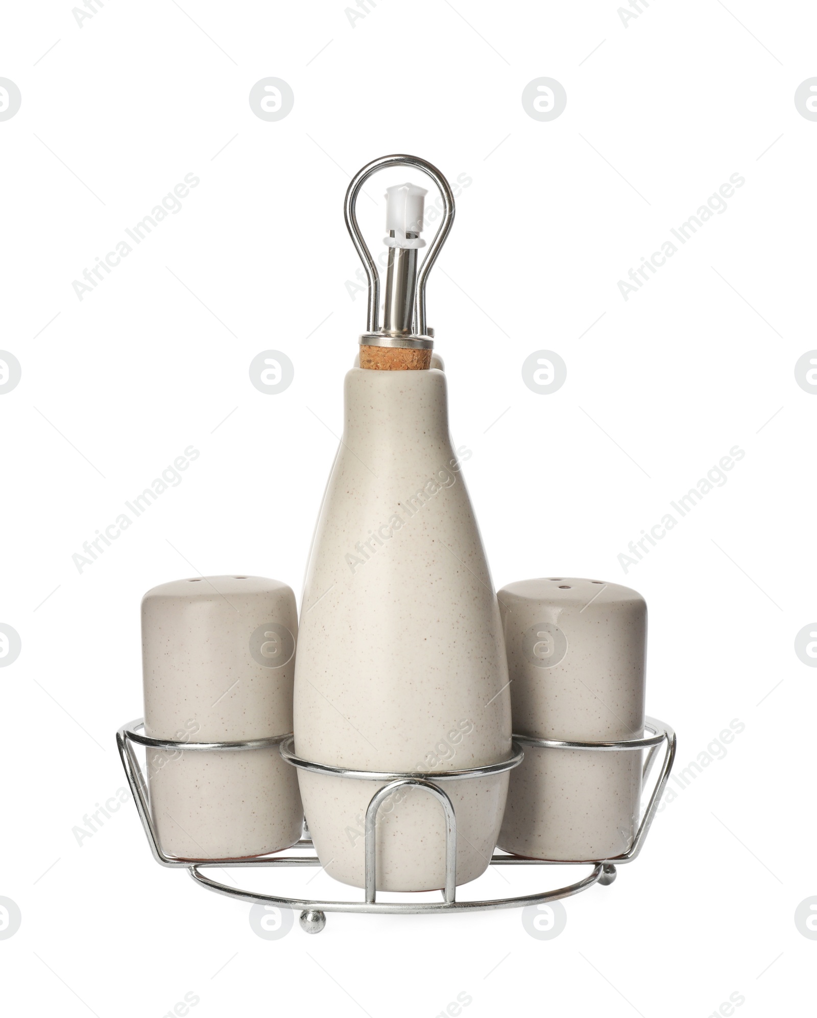 Photo of Set of sauce bottle with salt and pepper shakers in holder on white background