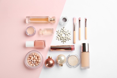 Photo of Flat lay composition with decorative cosmetic products on color background. Winter care